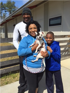 The Walker family, which volunteers at the shelter on Saturdays, adopted little Anya.