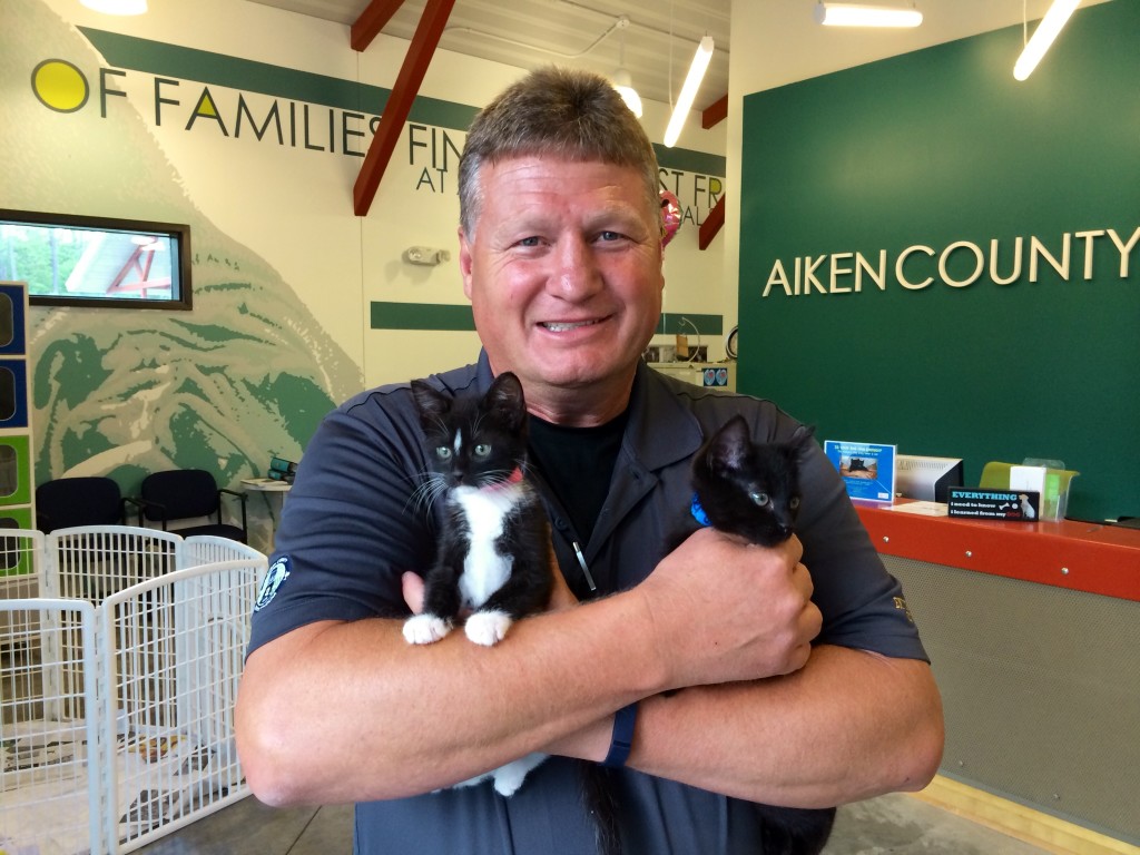 Bobby Arthurs, Aiken County Animal Shelter manager, holds Ricky and Turner