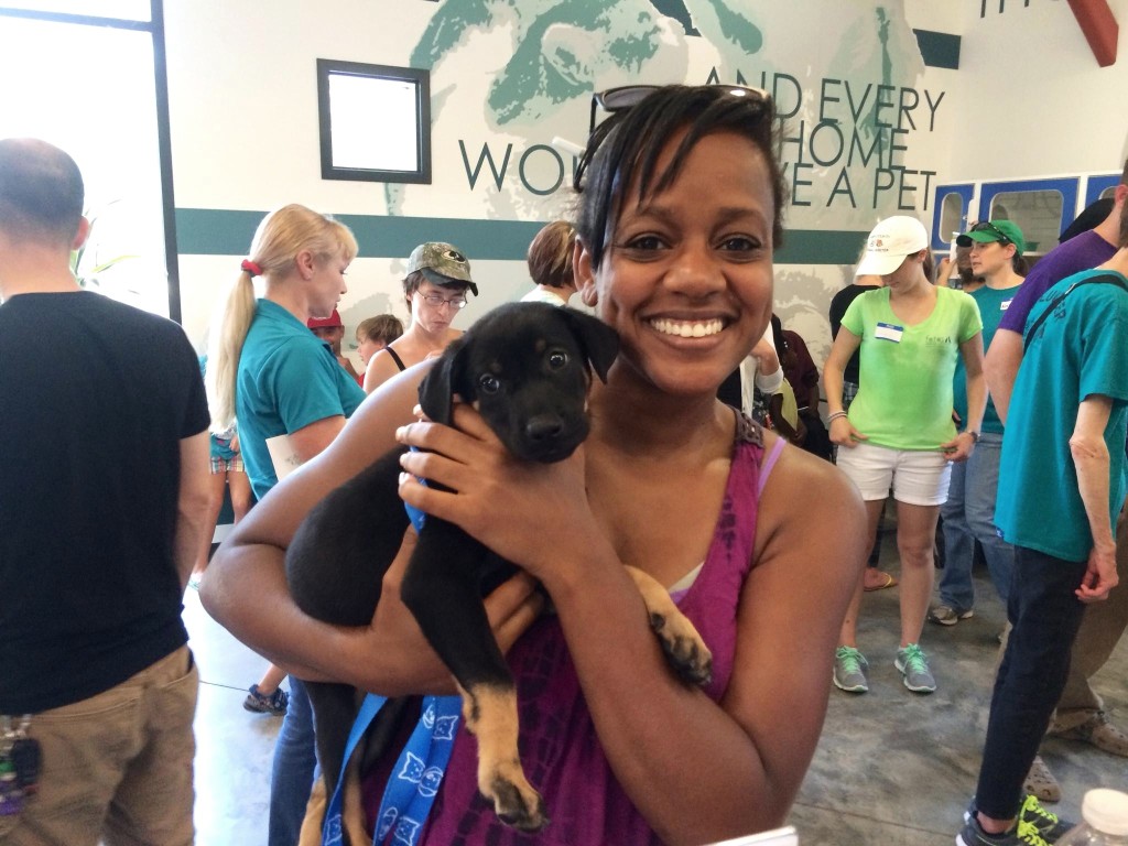 Patricia Rameau of Aiken adopts Robin, a hound puppy, on Clear the Shelters day.