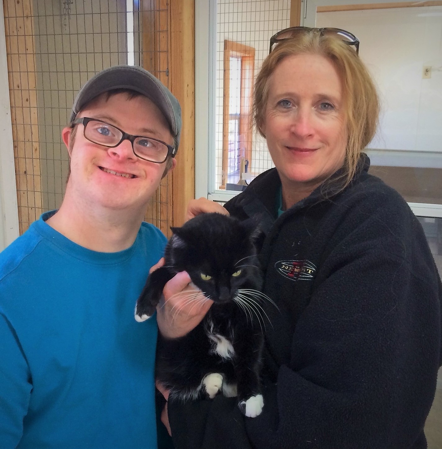 Derek and his mom, Susan Walker, volunteer at the shelter twice a week and help socialize shelter animals like Miss Kitty, a 2-year-old tuxedo cat who needs a home.