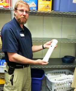 Randy Bush holds pipe for feeding