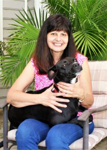 Dr. Lisa Levy at home with her three-legged family member, Trinity. 