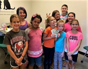 Birthday girl Audrey Dietzel (holding cash donation) hosted her birthday party at the Coun