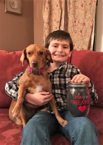 Nine-year-old Alex Mastromonico with his adopted dog, Bailee.