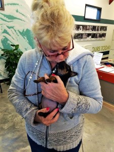 FOTAS Volunteer Wanda Johnson and one of her foster puppies.