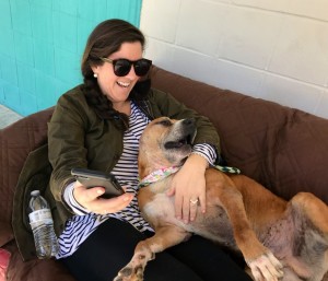 Volunteer Anne Morgan gives Biscuit some couch time.