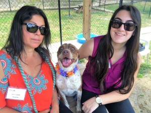 Volunteers Olga and Nicole Simons with their latest photo shoot model, Ginger.