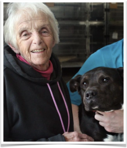 Joanne Goble sits in the lobby with Mac.