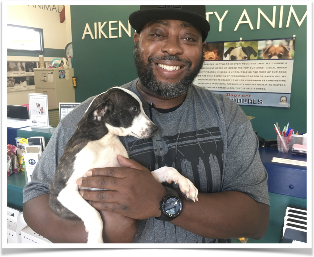 Bandit heads home with his new “dad.”