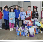 First Baptist Church preschoolers deliver donations to the County Shelter.