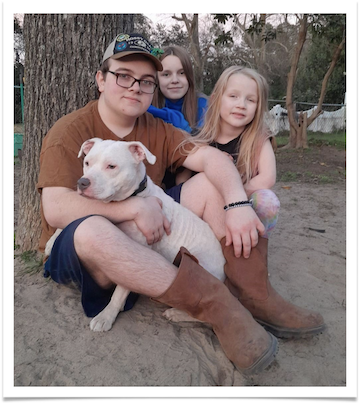 Ghost (formerly known as Boogie) at his new home with his human siblings.