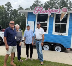 Volunteers John and Judi Sauer, Belinda Ebert and John Byrnes gather for Flanigans’s ice cream!